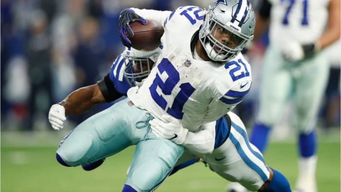 Ezekiel Elliott lunching forward against the Colts.